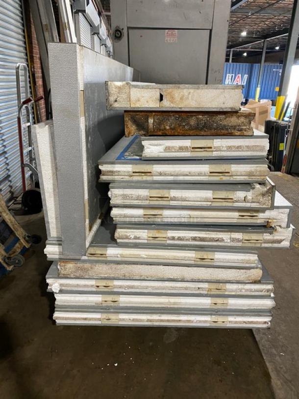 Koloac 10' x 10' walk-in cooler components, showing panels and parts, includes floor, compressor, and blower. Used condition.