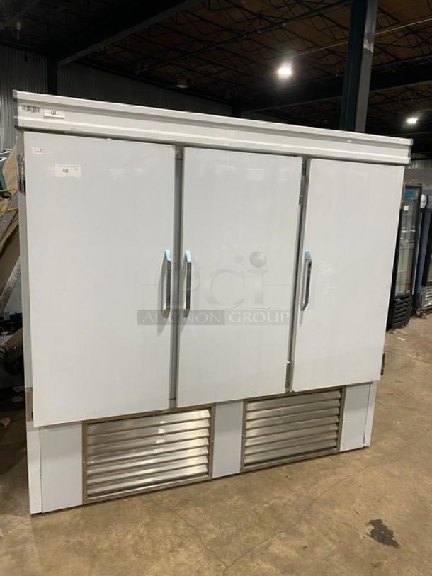 Commercial white 3-door reach-in refrigerator with poly coated wired rack, stainless steel vents, in excellent condition.
