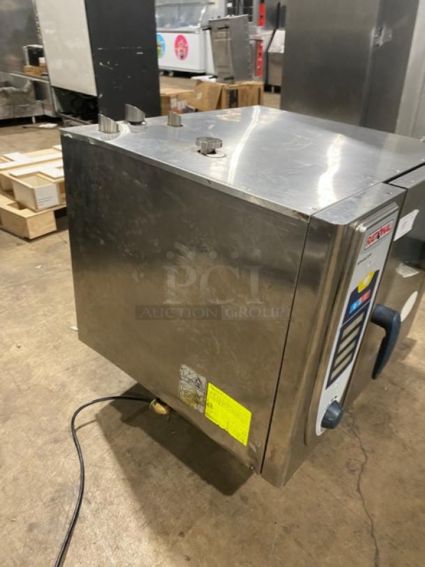 Rational SelfCooking Center commercial stainless steel combi oven with built-in pan slide, on legs, used condition.