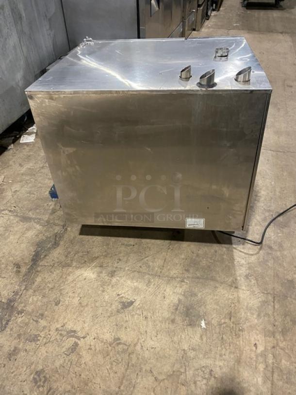 Rational stainless steel SelfCooking Center combi oven with built-in pan slide, visible power cord, and sturdy legs.