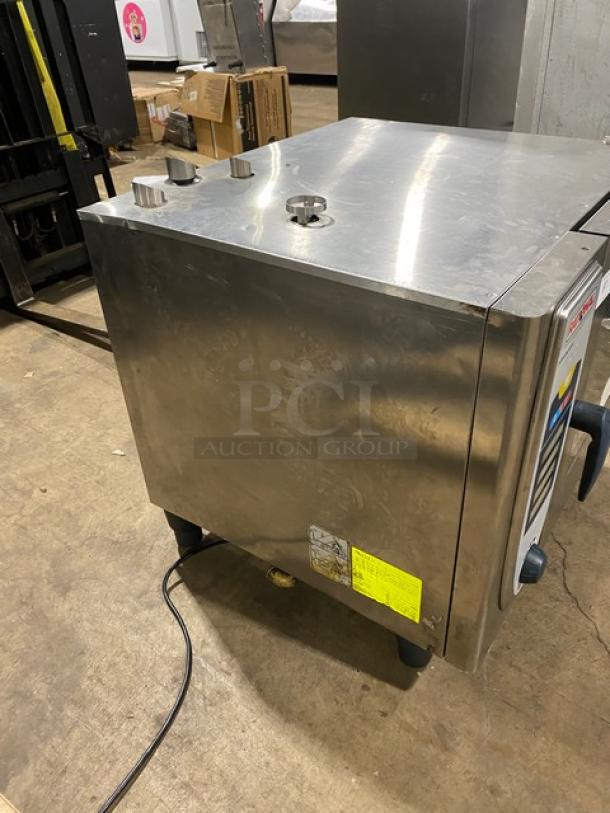 Rational electric SelfCooking Center combi oven, stainless steel, with built-in pan slide, on legs. Good condition.