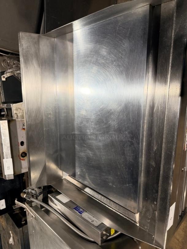 MagiKitch'n commercial heavy-duty gas griddle with mirror shine finish on a stainless steel stand, thermo-controlled, excellent condition.