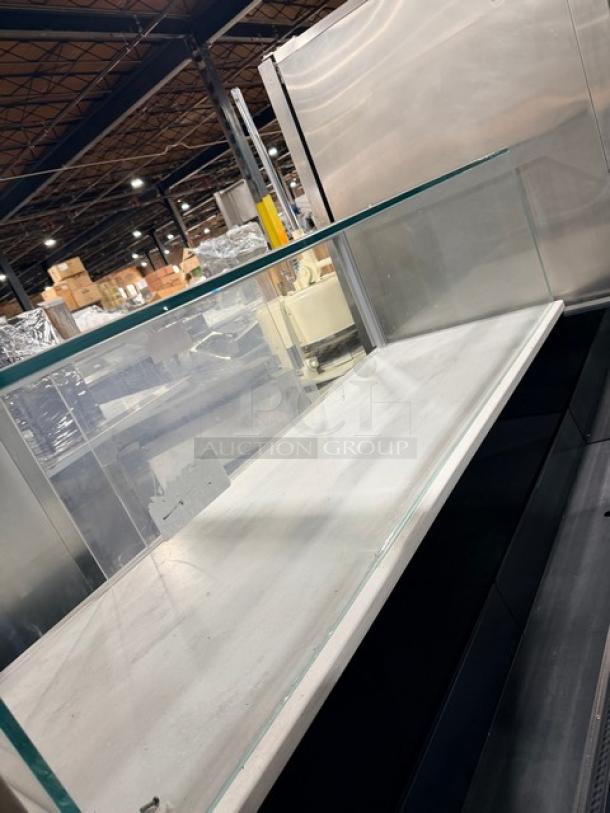 Structural Concepts SBZ6652DR black refrigerated grab-n-go display case with glass top, rear sliding doors, on legs, 220V.