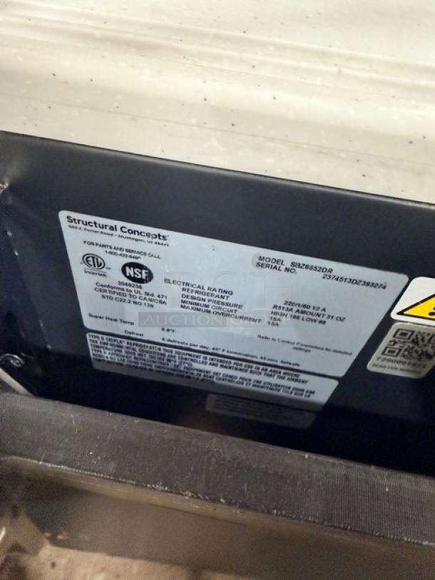 Structural Concepts SBZ6652DR commercial grab-n-go merchandiser label, showcasing model and serial number details.