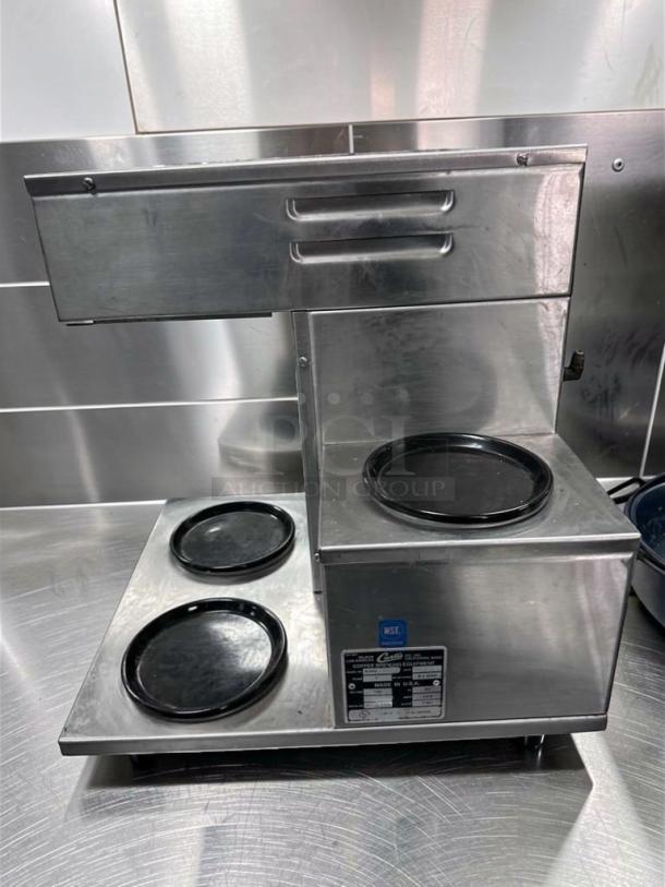 Alt text: Curtis Alpha AP-1D Automatic Coffee Brewer, stainless steel, NSF certified, excellent condition, model label visible.