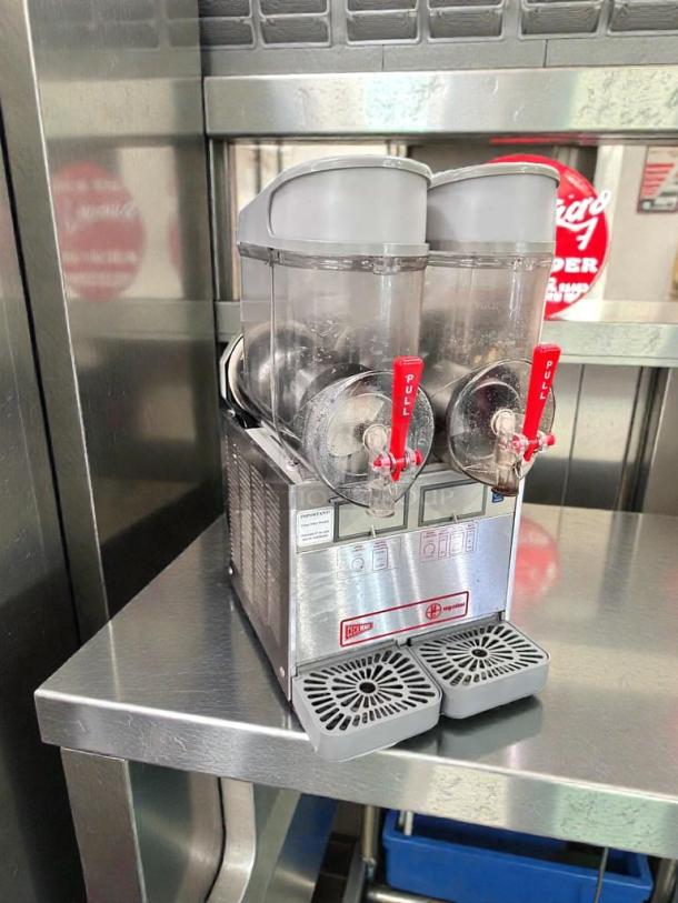 Ugolini NHT2 double bowl slush machine, superior condition, NSF & UL listed, tags indicate fully tested operational status.