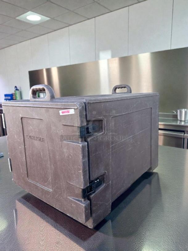 Carlisle Commercial Insulated Food Carrier in impeccable condition, black, with sturdy handles and secure latches. Model CAR-S-HOT-0545.