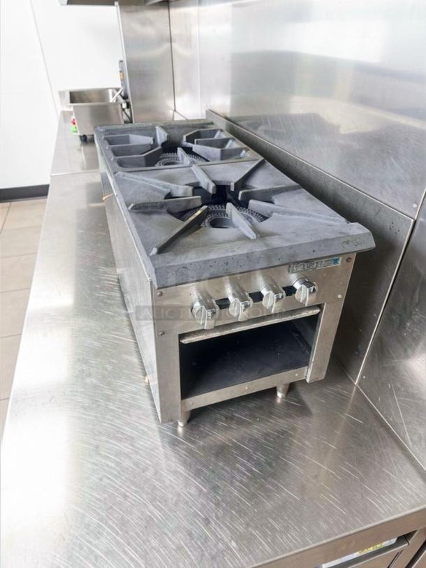 Vulcan 36" commercial gas range, 4 burners, open cabinet base, excellent condition, fully tested, stainless steel finish.