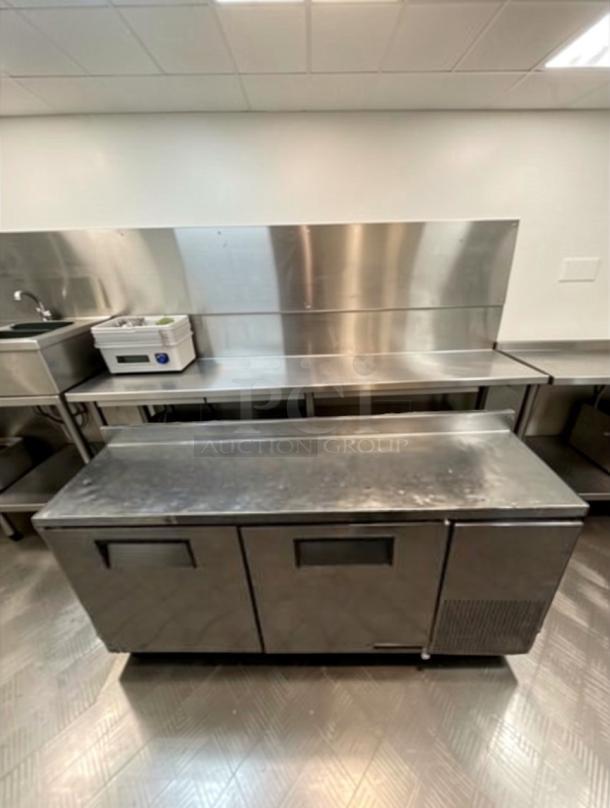 Delfield 3-door stainless steel refrigerated worktop prep table. Elite condition, fully tested, commercial model.