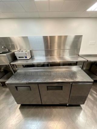 Delfield 3-door stainless steel refrigerated worktop prep table. Elite condition, fully tested, commercial model.