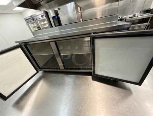 Delfield 3-Door Refrigerated Prep Table, stainless steel, elite condition, fully tested, operational, open doors visible.