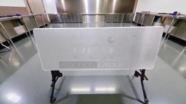 Commercial grade 6 ft folding flip-top training table by Commercial Institutional Furniture, with a rolling mobile frame.
