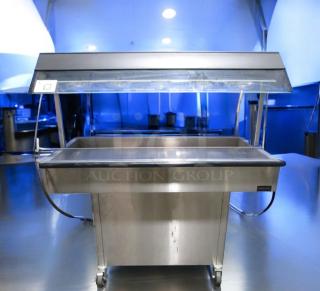 Duke E304 4-well electric steam table with sneeze guard, very good condition, 208V, fully tested, stainless steel.