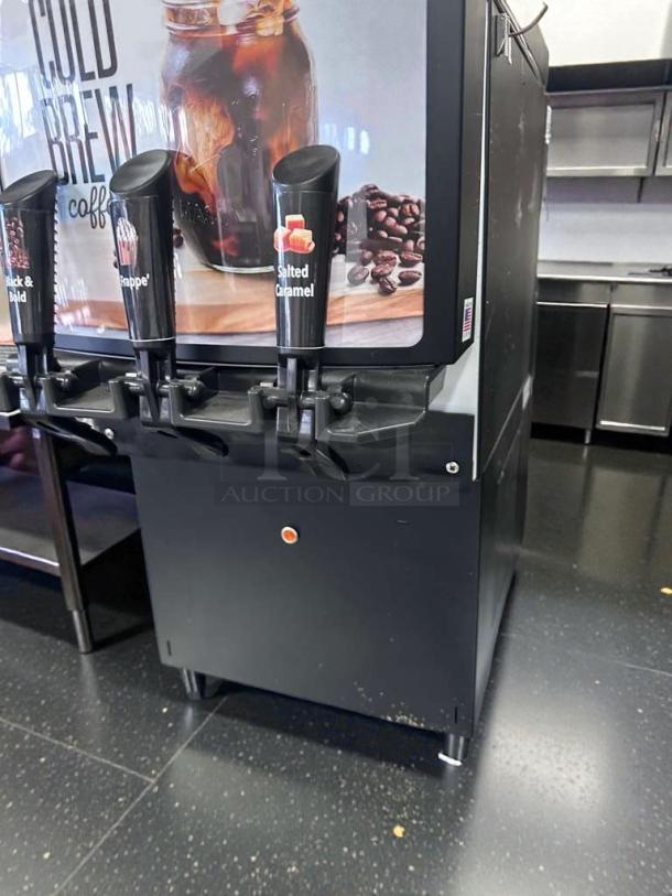 Excellent condition GoodWest GW2/GW3 commercial cold brew coffee dispenser, fully tested, 115V, three labeled taps, black finish.