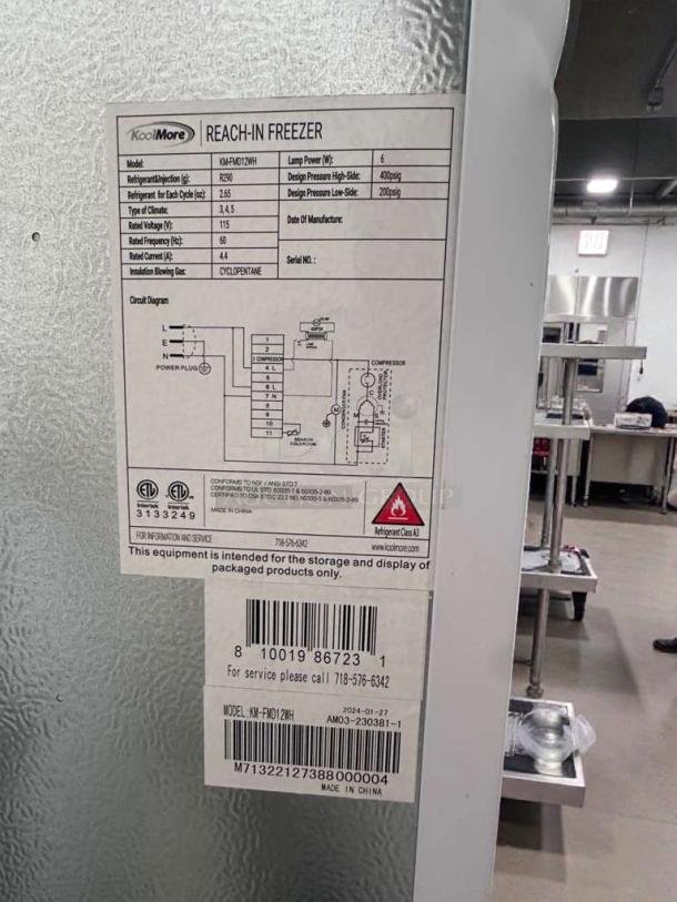 KoolMore KM-FMD12WH commercial reach-in freezer, 12 cu. ft., ETL & UL listed, fully tested, model details visible.