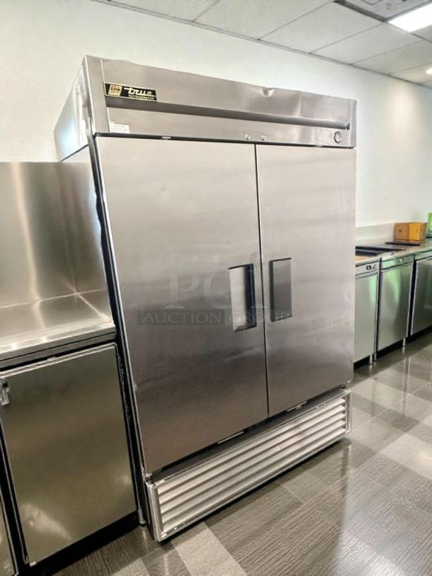 Pristine True T-49 commercial reach-in refrigerator, two-door, stainless steel, 115V, UL listed, fully tested, True logo visible.