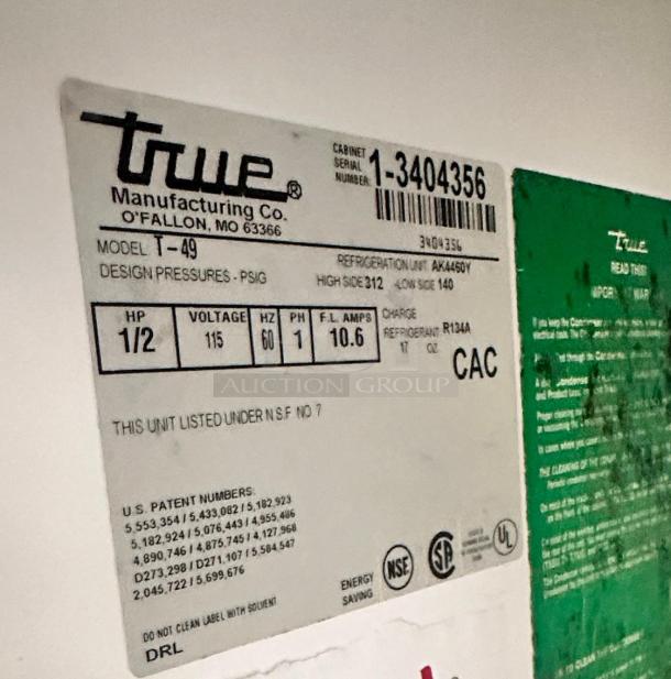 Close-up of label on True T-49 commercial refrigerator. Indicates model, voltage (115V), fully tested, UL and NSF listed.