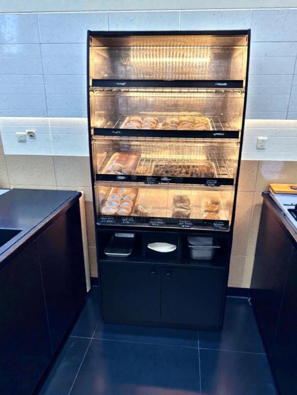 Turbo Air refrigerated bakery display case, model TA-L-BDC-0512, glass merchandiser, LED lit, excellent condition.