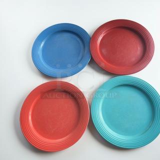 Four colorful 10.5-inch commercial dinner plates featuring a ribbed design. Inspected, heavy-duty foodservice dishware.