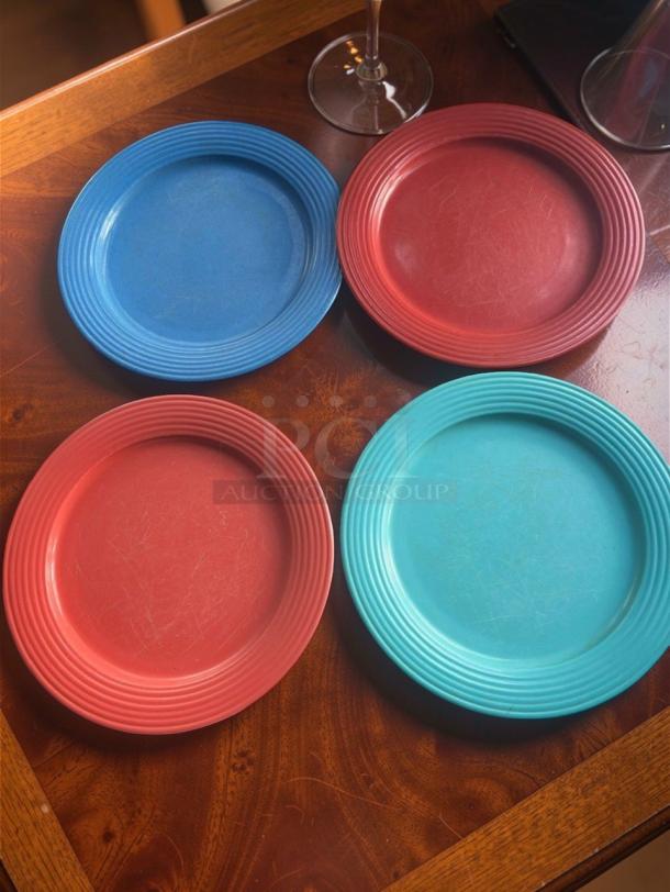 Set of four commercial dinner plates, 10.5 inches, heavy-duty, assorted colors, excellent condition, model OAS-M-PLT-0647.