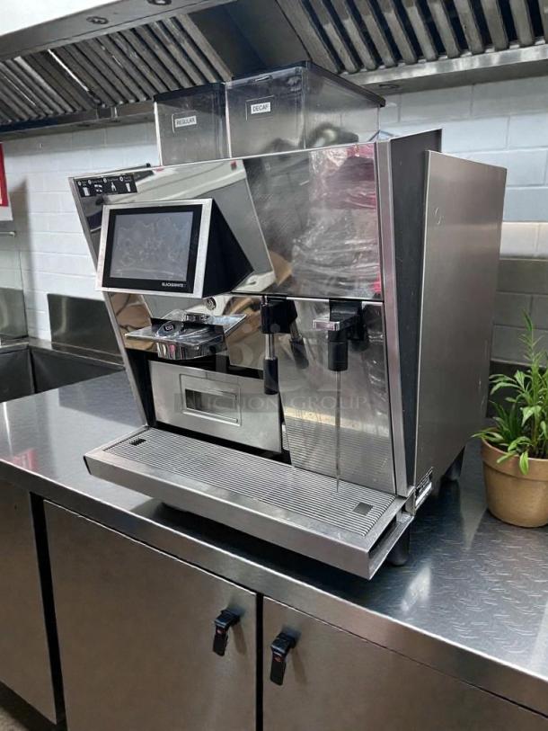 Premium Thermoplan Black&White 3 espresso machine, stainless steel, dual bean hoppers labeled Regular and Decaf, touchscreen display, UL & NSF listed.