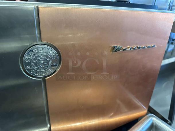 Starbucks Mastrena Commercial Espresso Machine in excellent condition, featuring dual hoppers, fully tested and operational.