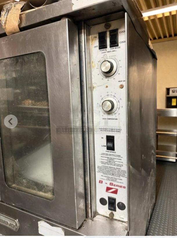 Blodgett double-stack convection oven in stainless steel. Features control knobs, switches, and operational labels visible.