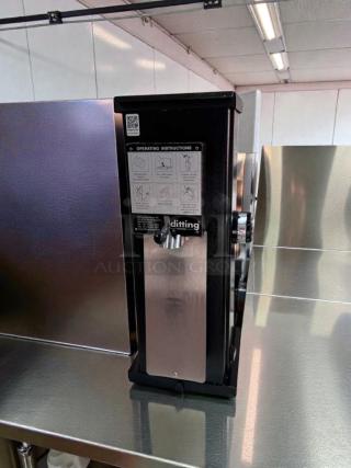 Ditting KR1203 commercial coffee grinder, excellent condition, Swiss made, 120V, ETL listed, with operating instructions visible.