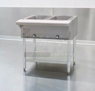 Commercial stainless steel dual well electric hot food table, model STEAM-M-HT-0535, in excellent condition.
