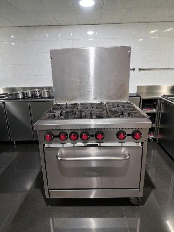 Montague 6-burner commercial gas range with oven, stainless steel, natural gas, NSF listed, fully tested, model MON-L-GAS-0542.