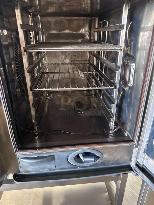 Stainless steel Rational SelfCookingCenter combi oven interior with racks, fully operational, model RAT-L-CMB-0636.