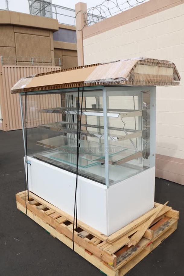 Brand new Avantco BCD-60-SW 60" white square dry bakery display case on pallet; glass shelves, 110V, 0.35A, possible missing parts.