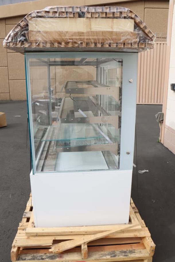 Brand new Avantco BCD-60-SW 60" white square dry bakery display case on pallet, out of original packaging.