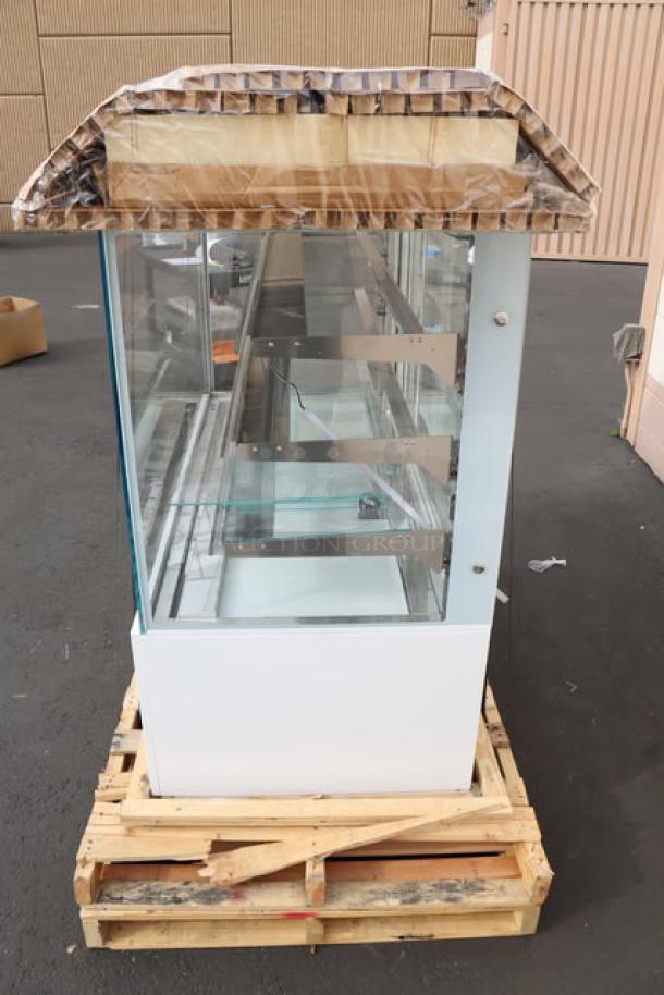 Brand new Avantco BCD-60-SW 60" white square dry bakery display case on pallet, 110V, 0.35 Amp, 1 Phase, S/N: 5881016243831027.