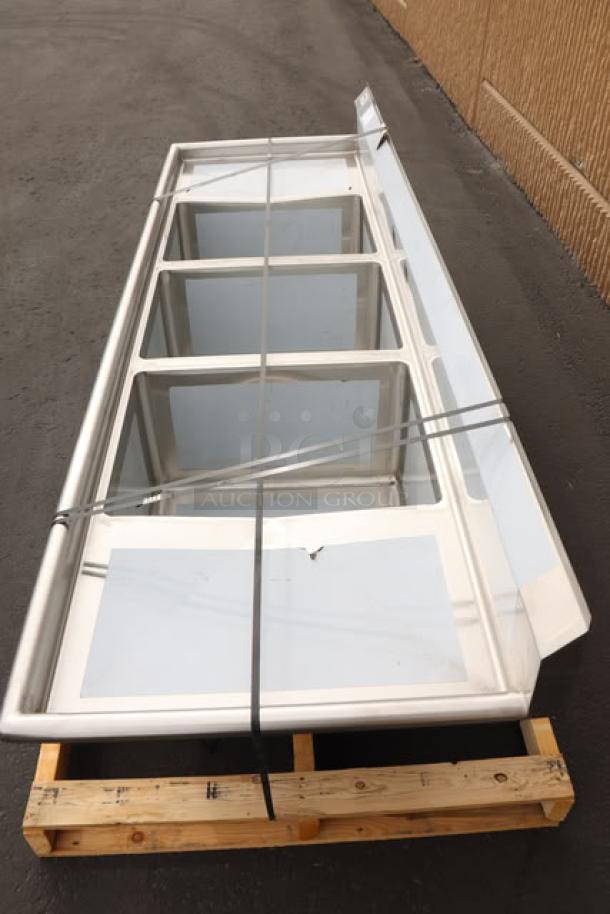 Regency 94" stainless steel three-compartment sink, model 600S31824218, with 18"x24"x14" bowls, drainboards, minor scuffs, and dents.