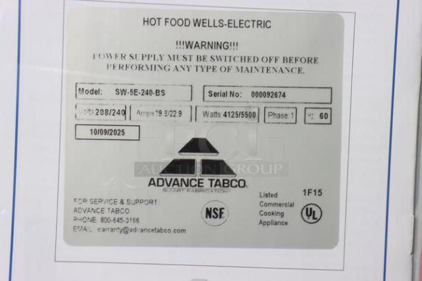 Alt text: "Label of Advance Tabco SW-6E-240-BS Six Pan Electric Hot Food Table, model and serial number details visible."