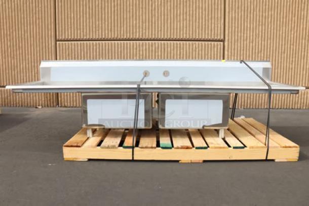 Regency S2C232312-24L&R 96" stainless steel two-compartment sink with dual drainboards; new, unboxed, minor scuffs.