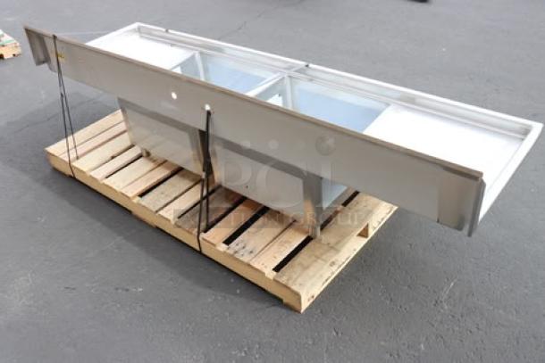 Brand new Regency S2C232312-24L&R two-compartment stainless steel sink with drainboards, 96", unboxed. May have minor scuffs.