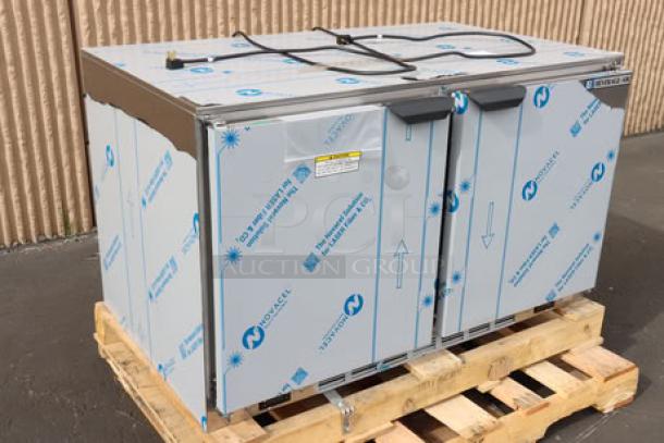 Brand new Beverage-Air UCRF48AHC-1-SA-B-23 48" dual temp undercounter fridge/freezer on pallet. Minor scuffs visible.