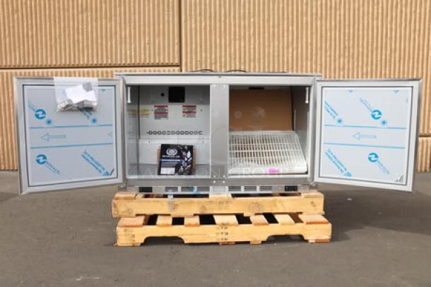 Beverage-Air UCRF48AHC-1-SA-B-23 dual temp undercounter fridge/freezer with doors open. Brand new, minor scuffs. Serial: 15604720.