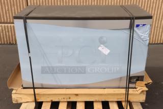 Brand new Manitowoc IYT1500A ice machine, air cooled, 48", 1660 lb capacity; exterior scratched and dented.