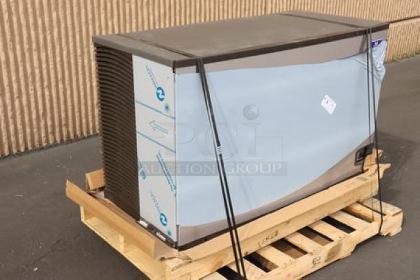 Manitowoc IYT1500A Ice Machine, new with exterior scratches and dents, on a pallet. Model info and serial number visible.