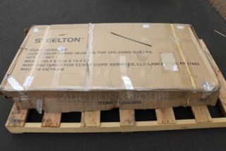 Brand new Steelton ES-3060 stainless steel equipment stand in packaging, with 30" x 60" surface, undershelf, and galvanized legs.