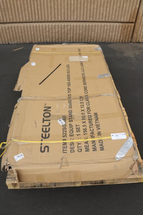 Brand new Steelton ES-3060 equipment stand, 30" x 60", 18-gauge stainless steel, with undershelf and galvanized legs, in original packaging.