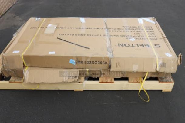 Brand new Steelton ES-3060 30" x 60" 18-gauge stainless steel equipment stand, boxed on pallet, model number visible.