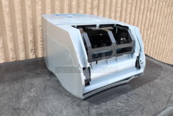 Brand new San Jamar T8370SS hands-free paper towel dispenser, stainless steel look, visible scratches on the surface.