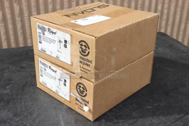 Two boxes of brand new Sloan 3012600 186 Royal Flush Valves, exposed manual urinal flushometer, visible labels.