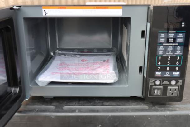 Danby 3.1MF7-7B1 MicroFridge, black with two doors, 3.1 Cu. Ft. capacity, microwave shown open, new condition, 115V, 15A.