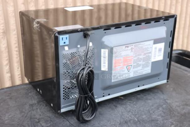 Danby 3.1MF7-7B1 MicroFridge back view showing power cord, vents, and caution labels; new condition, black finish.