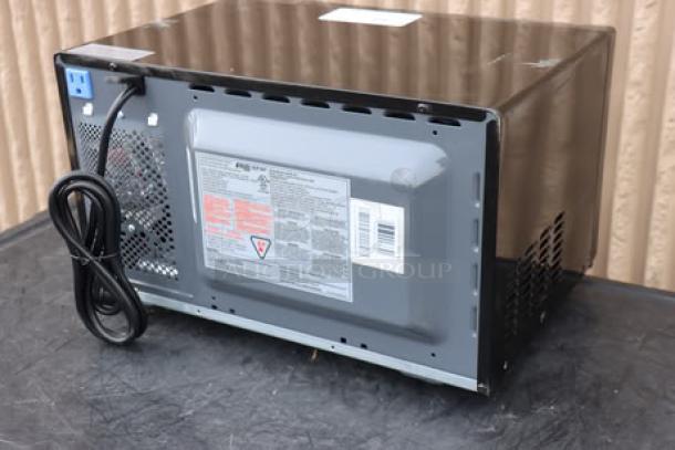 Back view of new Danby 3.1MF7-7B1 MicroFridge. Black, 3.1 cu. ft., two-door with microwave. Label shows specifications, 115V, 15A.